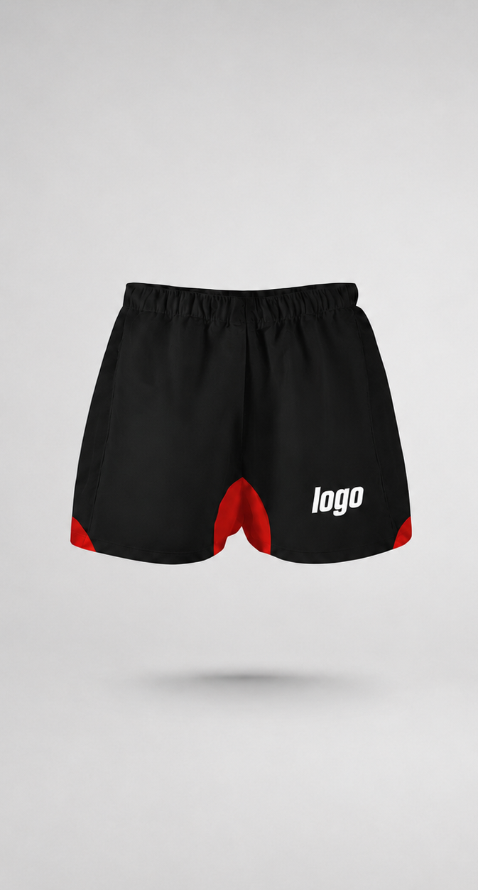 Front view of rugby athletic shorts with red accents and featuring a logo on the left leg